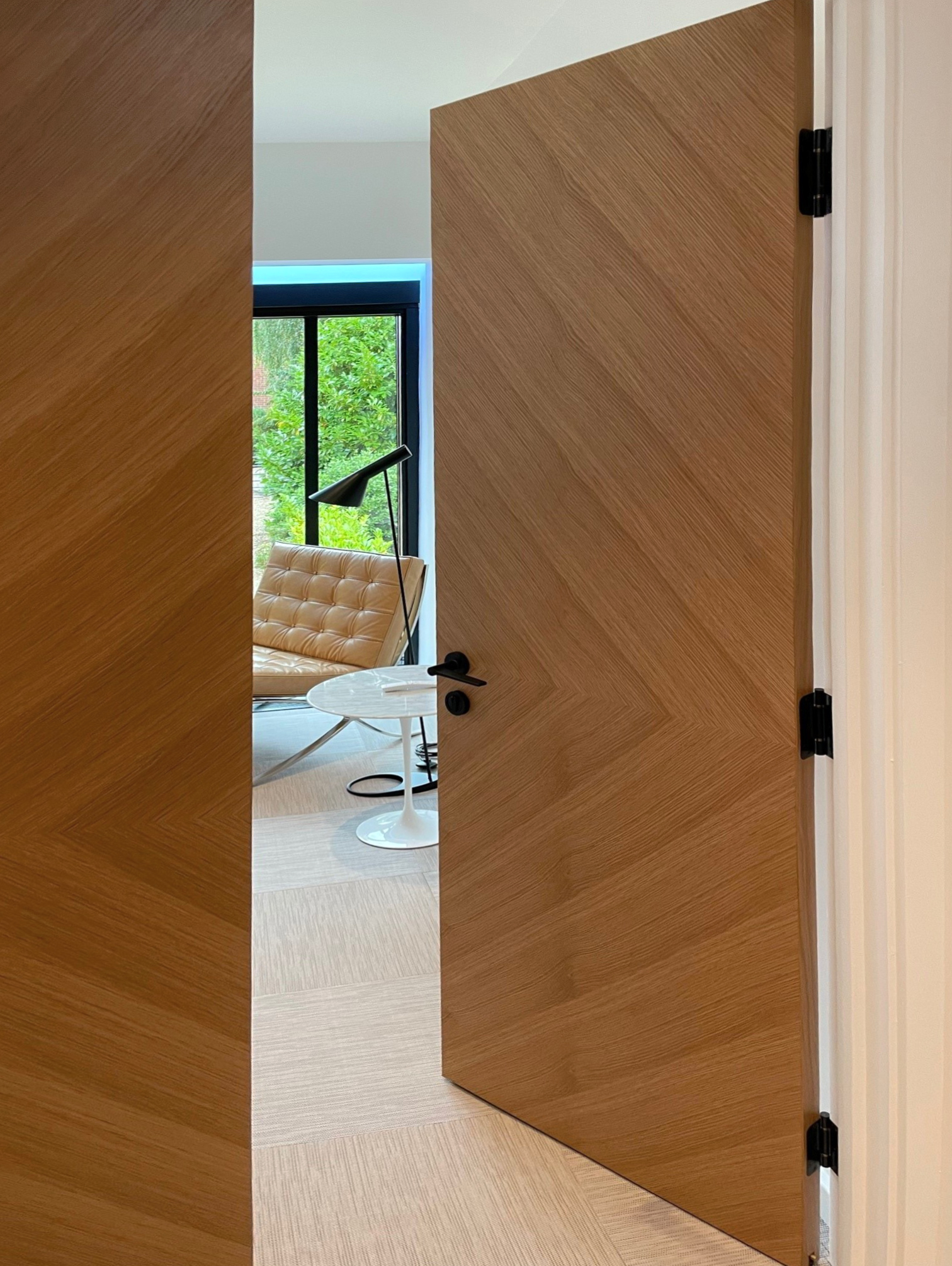 Ahmarra Manufactures Chevron Veneered Doors for Local Architect Firm